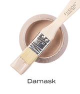 Open Damask Fusion Mineral Paint jar with paintbrush resting on top, bristles dipped in matte finish paint.