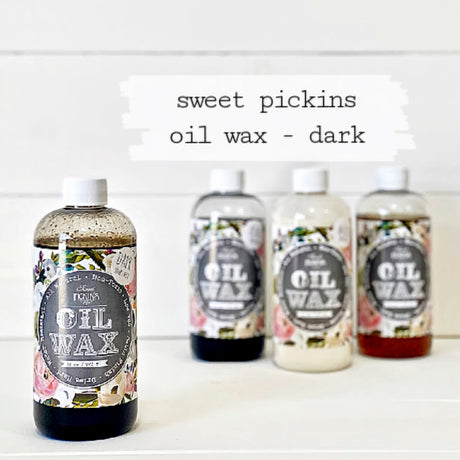 Four bottles of Sweet Pickins Dark Oil Wax by Old Fashioned Milk Paint for natural wood finish and sealing.
