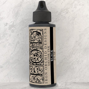 I.O.D. Decor Ink, 2 fl oz bottle, black pigment-rich formula with ornate beige and black label by Iron Orchid Designs.