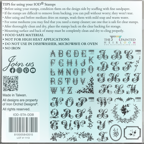 Dessins de Broderie Labels Mini Stamp by I.O.D. with ornate motifs, care tips, and branding visible on packaging.