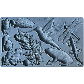 I.O.D. Dewdrop Pond Mould with pond animals, insects, plants, and cavity measurement markings.