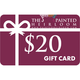 The Painted Heirloom Digital eGift Card with a white ribbon on a maroon background.