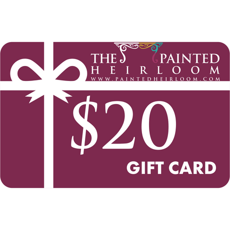 The Painted Heirloom Digital eGift Card with a white ribbon on a maroon background.