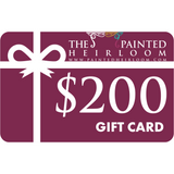 The Painted Heirloom $200 Digital eGift Card with maroon background and white bow on the front.