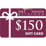 The Painted Heirloom $150 Digital eGift Card with a white bow on a maroon background.