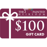 The Painted Heirloom $100 Digital eGift Card with a white ribbon on a deep maroon background.