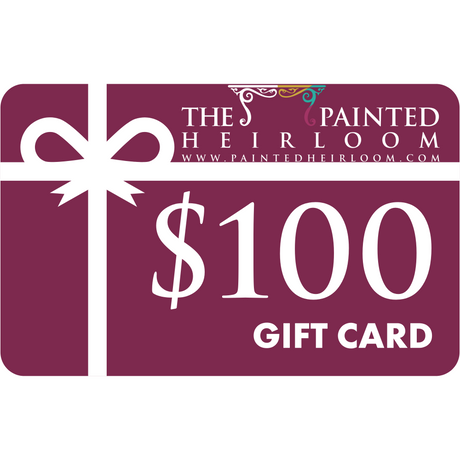 The Painted Heirloom $100 Digital eGift Card with a white ribbon on a deep maroon background.