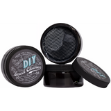 Three black DIY Paint Co. DIY Brush Cleaner containers, one open to show mesh insert and lids.