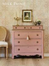 Vintage dresser in Homestead House Dusty Rose Milk Paint with brass handles.