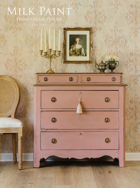Vintage dresser in Homestead House Dusty Rose Milk Paint with brass handles.