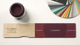 Open jar of Fusion Mineral Paint Elderberry matte finish with color samples and Elderberry swatch nearby.