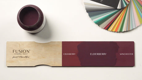 Open jar of Fusion Mineral Paint Elderberry matte finish with color samples and Elderberry swatch nearby.