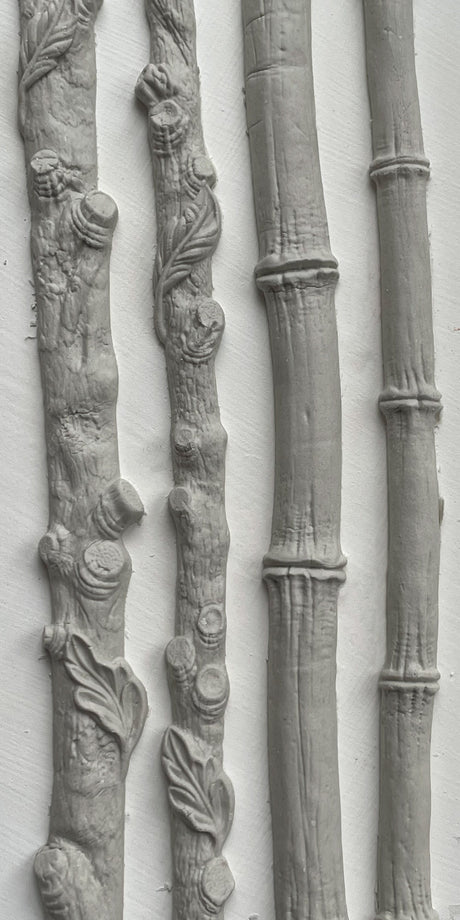 IOD Faux Bois Mould with four gray, bark-textured trim pieces for nature-inspired decorative use.