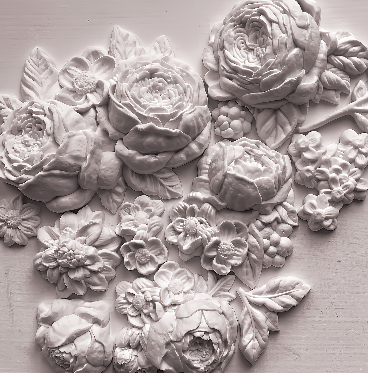 Felicite Mould by IOD featuring raised floral carvings in a light monochrome style for flat surfaces.