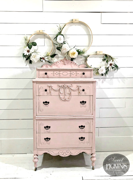 Vintage dresser in First Crush by Old Fashioned Milk Paint, with floral embroidery hoops displayed on top.
