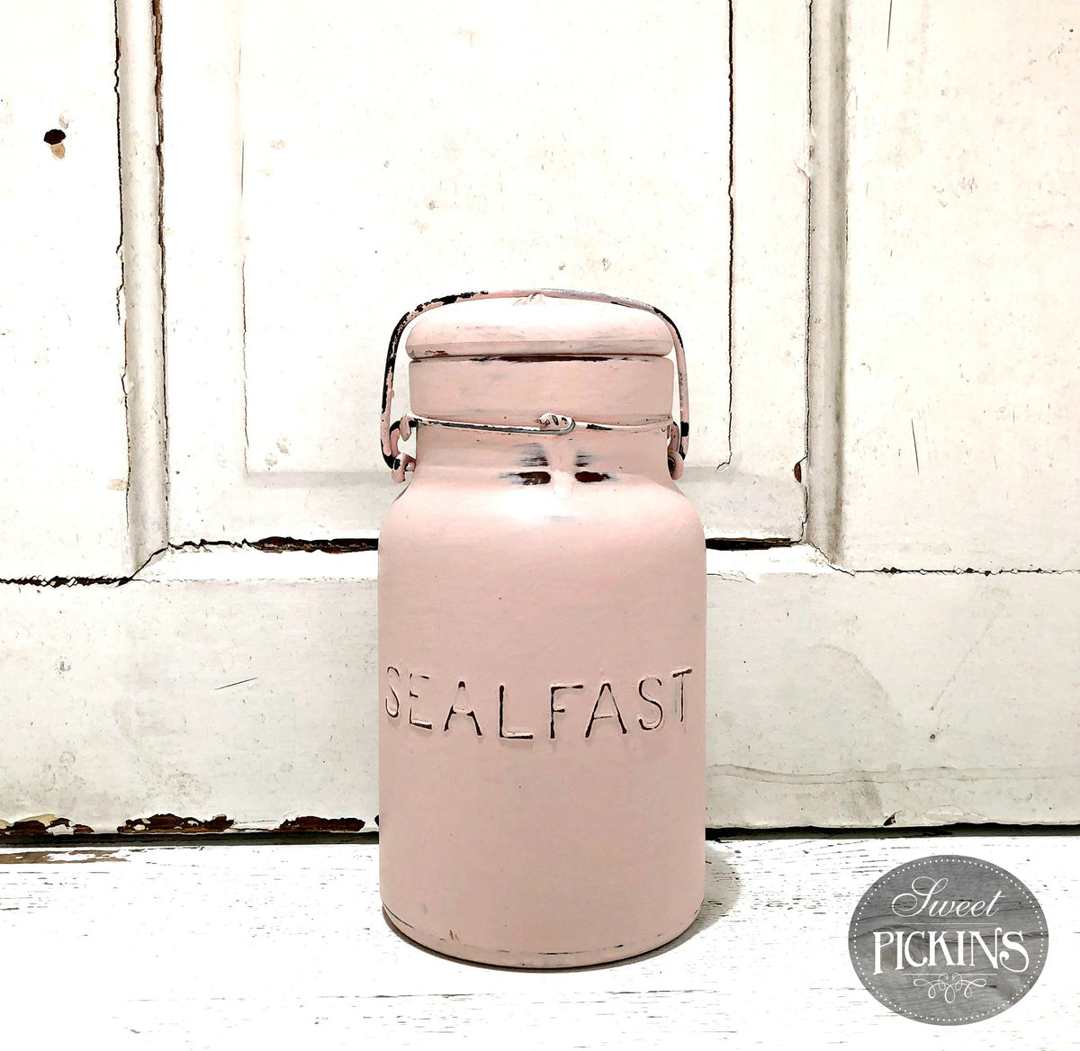 Pink SEALFAST jar labeled First Crush Sweet Pickins Milk Paint by Old Fashioned Milk Paint on white surface.