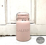 Pink SEALFAST jar labeled First Crush Sweet Pickins Milk Paint by Old Fashioned Milk Paint on white surface.