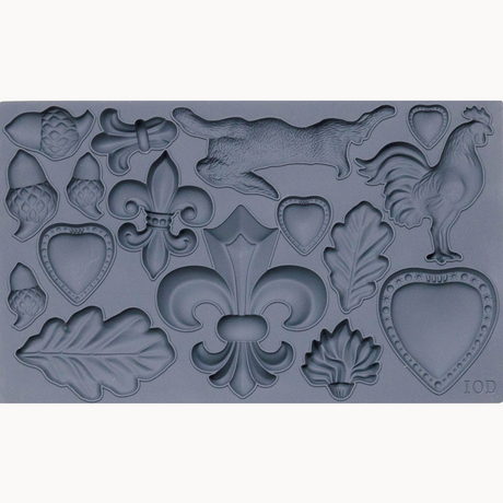 I.O.D. Fleur-de-lis Mould with hearts, acorns, rooster, leaves, running animal, and fleur-de-lis motifs.