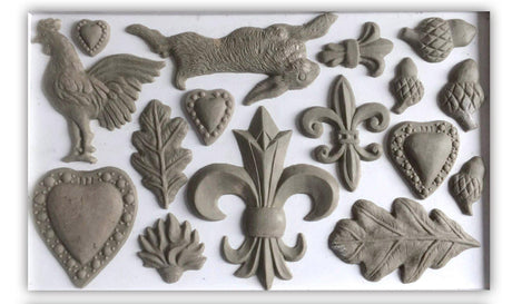Gray resin hearts, acorns, leaves, and rabbit with I.O.D. Fleur-de-lis Mould by Iron Orchid Designs accents.