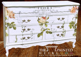 White vintage dresser with I.O.D. Flora Parisiensis Decor Transfer and ornate handles.