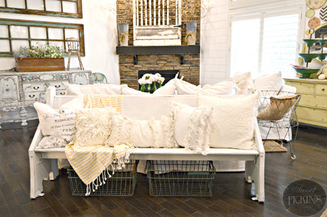 White bench in Old Fashioned Milk Paint Flour Sack with textured pillows.