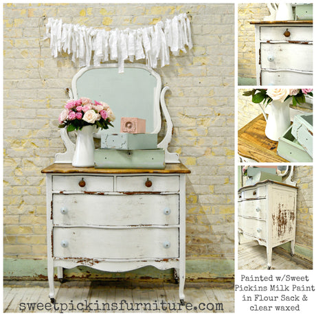 Distressed dresser with mirror in Flour Sack by Old Fashioned Milk Paint, rustic pink flowers and boxes.