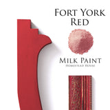 Fort York Red Milk Paint by Homestead House with red painted wood trim and a pile of red powder.