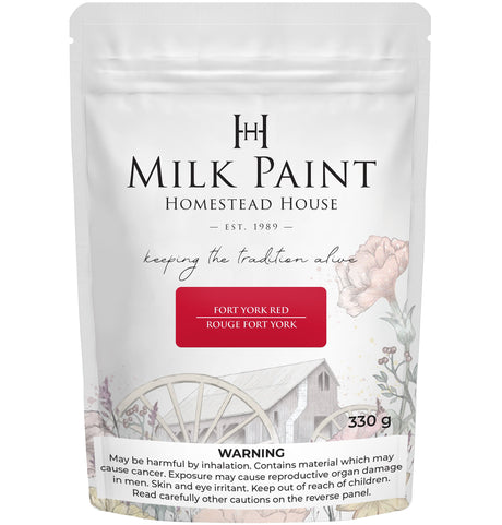 330g Fort York Red Milk Paint by Homestead House in a bag with floral and wagon wheel designs on the packaging.