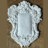 Frames 2 Mould by I.O.D., Baroque-style white frame with floral detail, suited for clay or silicone moulding.