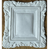 Ornate white frame with floral details made using I.O.D. Frames 2 Mould.