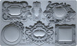 Six empty mini frames from the Frames 3 Mould by I.O.D. shown on a gray surface.