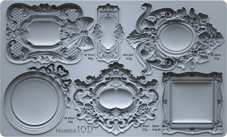 Six empty mini frames from the Frames 3 Mould by I.O.D. shown on a gray surface.