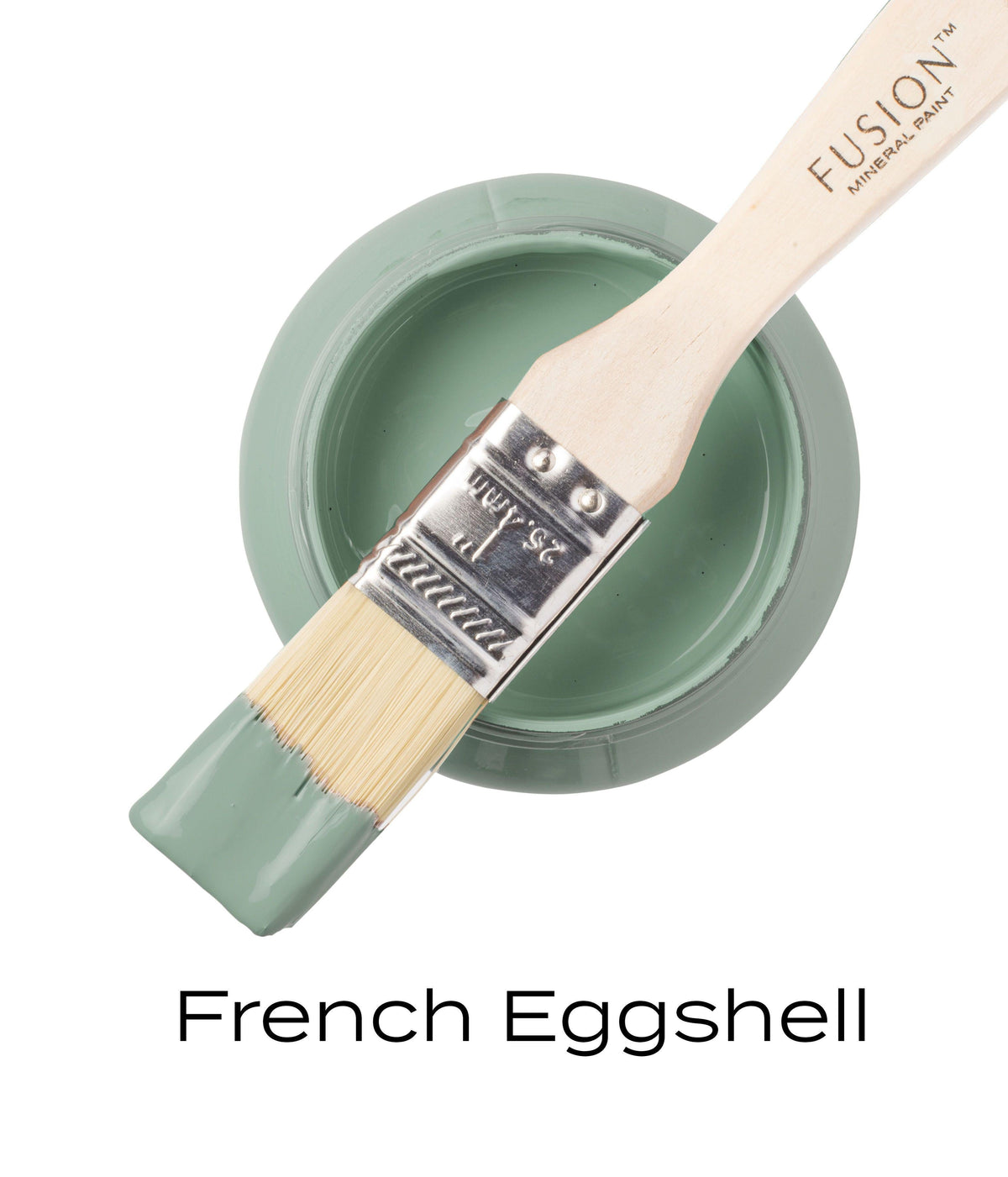 Open jar of Fusion Mineral Paint in French Eggshell with brush dipped in paint resting on the rim.