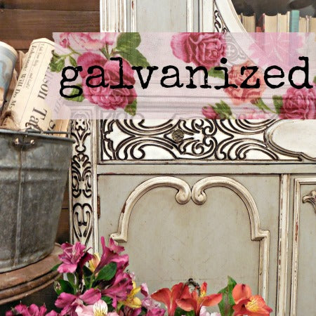 Ornate furniture with Old Fashioned Milk Paint Galvanized finish, metal bucket, flowers, and books displayed.