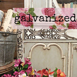 Ornate furniture with Old Fashioned Milk Paint Galvanized finish, metal bucket, flowers, and books displayed.