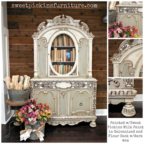 Ornate cream and brown hutch painted with Old Fashioned Milk Paint Galvanized by Sweet Pickins, books, florals in front.