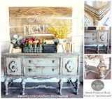 Vintage wooden sideboard in Galvanized Old Fashioned Milk Paint, topped with florals, books, and rustic decor.