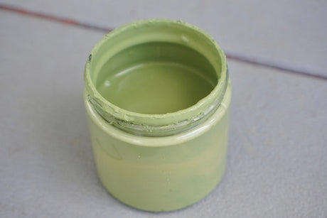 Open jar of DIY Paint Co. Garden Sage DIY Cottage Color on a gray surface.