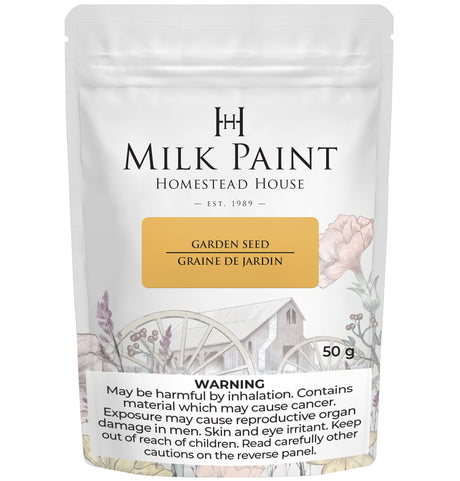 Garden Seed Milk Paint by Homestead House, 50g jar with health warning and floral art on white background.