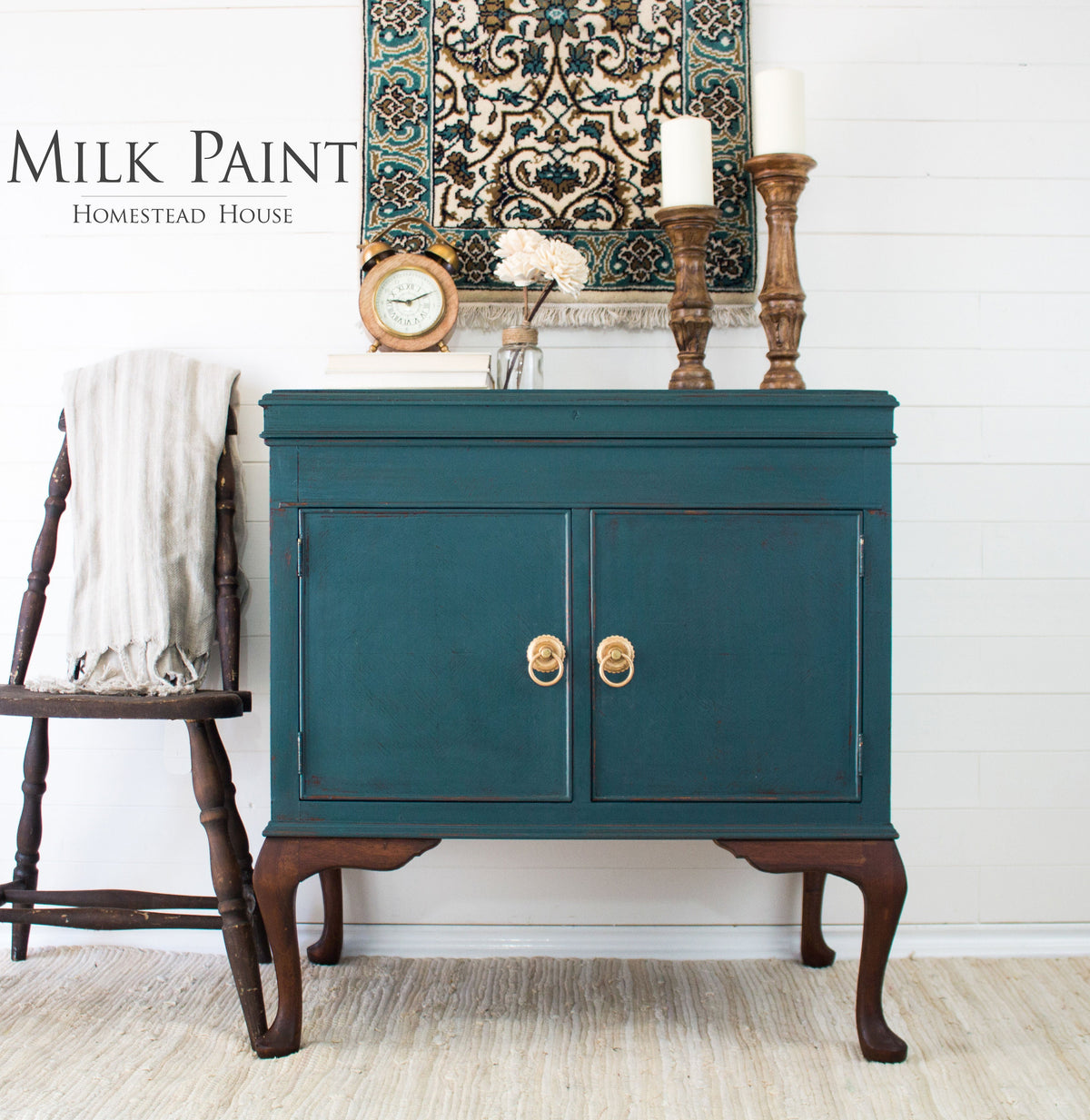 Sideboard in Gaspe Green Milk Paint by Homestead House with gold accents, candles, and a clock.
