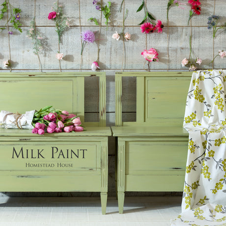 Two Homestead House Gatineau Milk Paint headboards with pink flowers and white cloth.