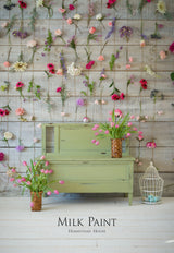 Green wooden console painted with Homestead House Gatineau Milk Paint, pink tulips, and birdcage decor.