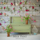 Green furniture painted with Gatineau Milk Paint by Homestead House, pink tulips, birdcage, and flowers on wood.