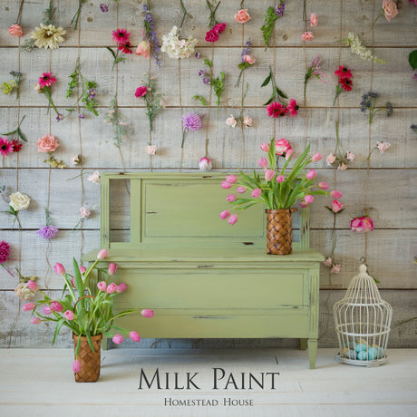 Green furniture painted with Gatineau Milk Paint by Homestead House, pink tulips, birdcage, and flowers on wood.