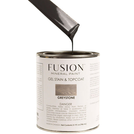 Open can of Fusion Mineral Paint Gel Stain & Top Coat in Greystone with dark paint stick inside.