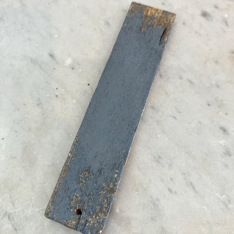 Worn wood rectangle with chipped edges, painted in DIY Paint Co. Gray Skies Cottage Color.