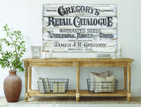 Wood console with decor under I.O.D. Gregory’s Catalogue Paint Inlay by Iron Orchid Designs on white wall.