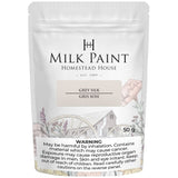 50g Grey Silk Milk Paint by Homestead House, label features health warnings and a floral wagon illustration.