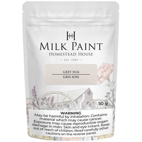 50g Grey Silk Milk Paint by Homestead House, label features health warnings and a floral wagon illustration.