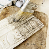 Grit Aging Dust by Sweet Pickins Old Fashioned Milk Paint shown on worn cutting board with aged white trim.